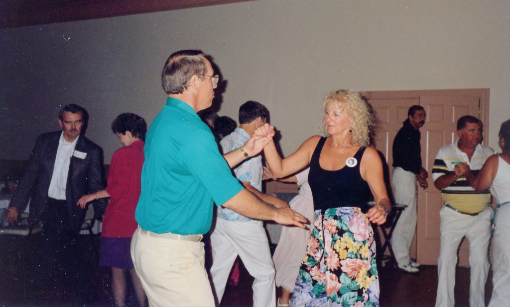 Grover Robinson & Carole Holland Doyle in center dancing